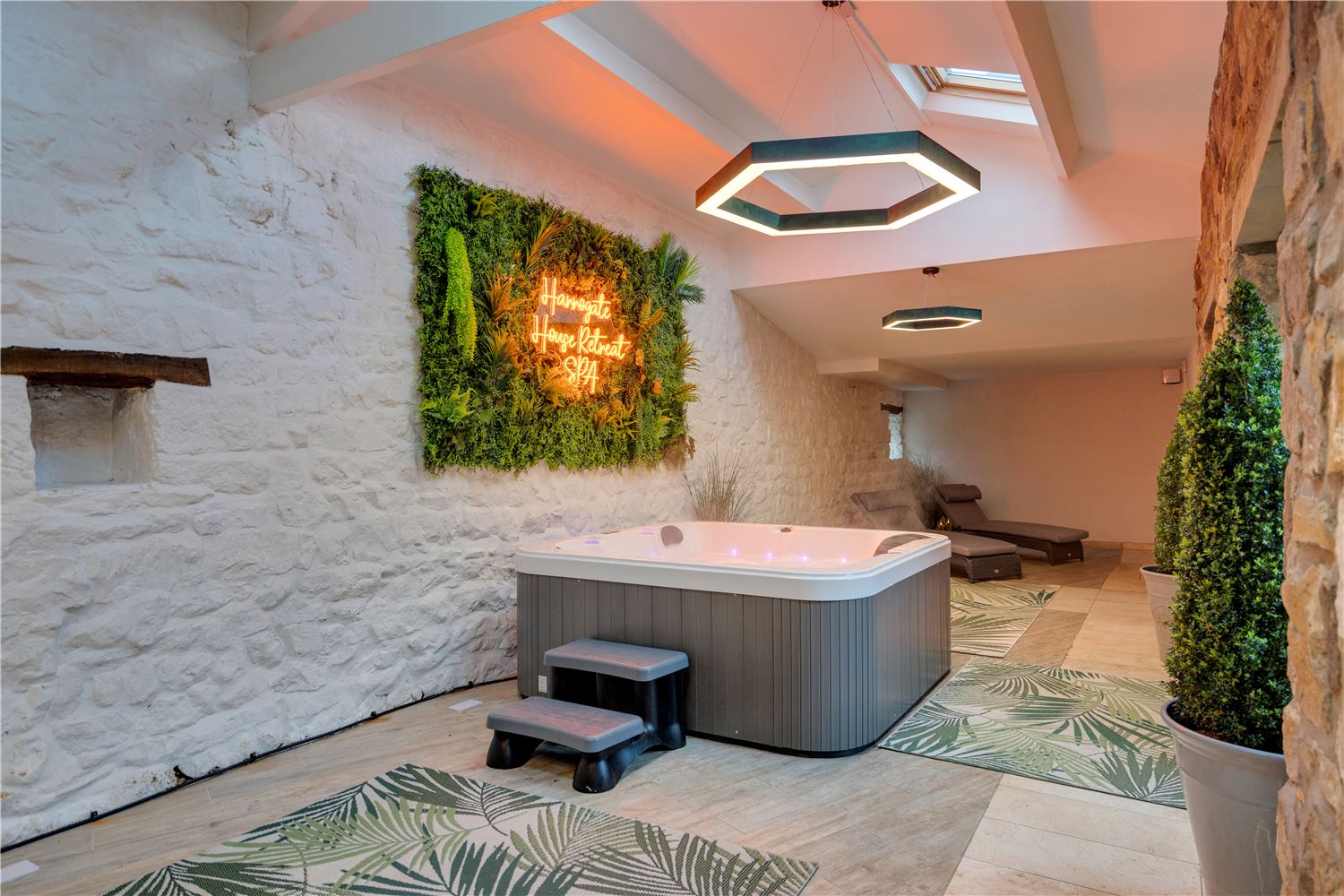 garden room with hot tub and loungers