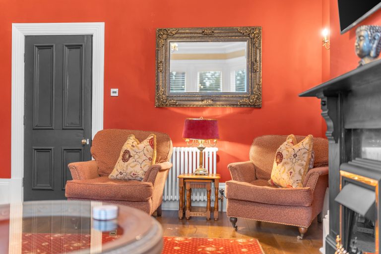 Photograph of the orange sitting room at Harrogate Heights house