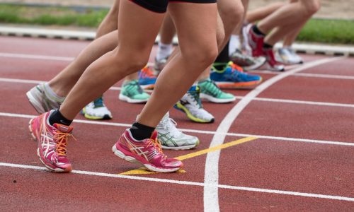 a group running in trainers on a track