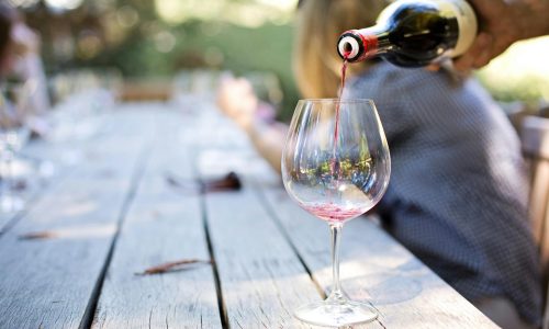 a glass of wine being poured